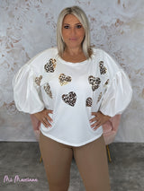 CAMISETA OVERSIZE CORAZONES ANIMAL PRINT MANGA ABULLONADA