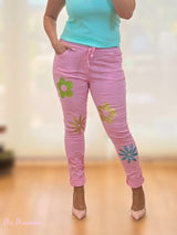 JEANS STROPICCIATO CON FIORI ROSA GLITTER