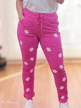 JEANS STROPICCIATO FUCSIA CON MARGHERITE BIANCHE