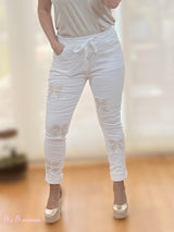 JEANS ARRUGADOS LAZOS BLANCO