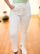 JEANS STROPICCIATO CON STRASS BIANCO