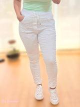 JEANS STROPICCIATO CON STRASS BIANCO