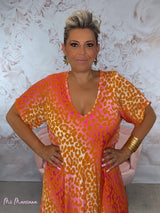 VESTIDO OVERSIZE ANIMAL PRINT OBLICUO  ESCOTE PICO MANGAS